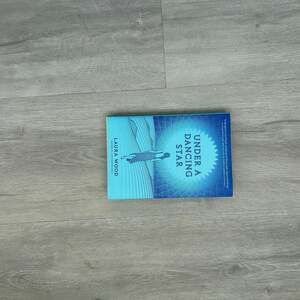 Under a Dancing Star by Laura Wood (Hardcover Book)